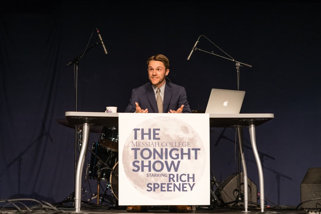 Tonight Show stage setup with branded podium and microphones